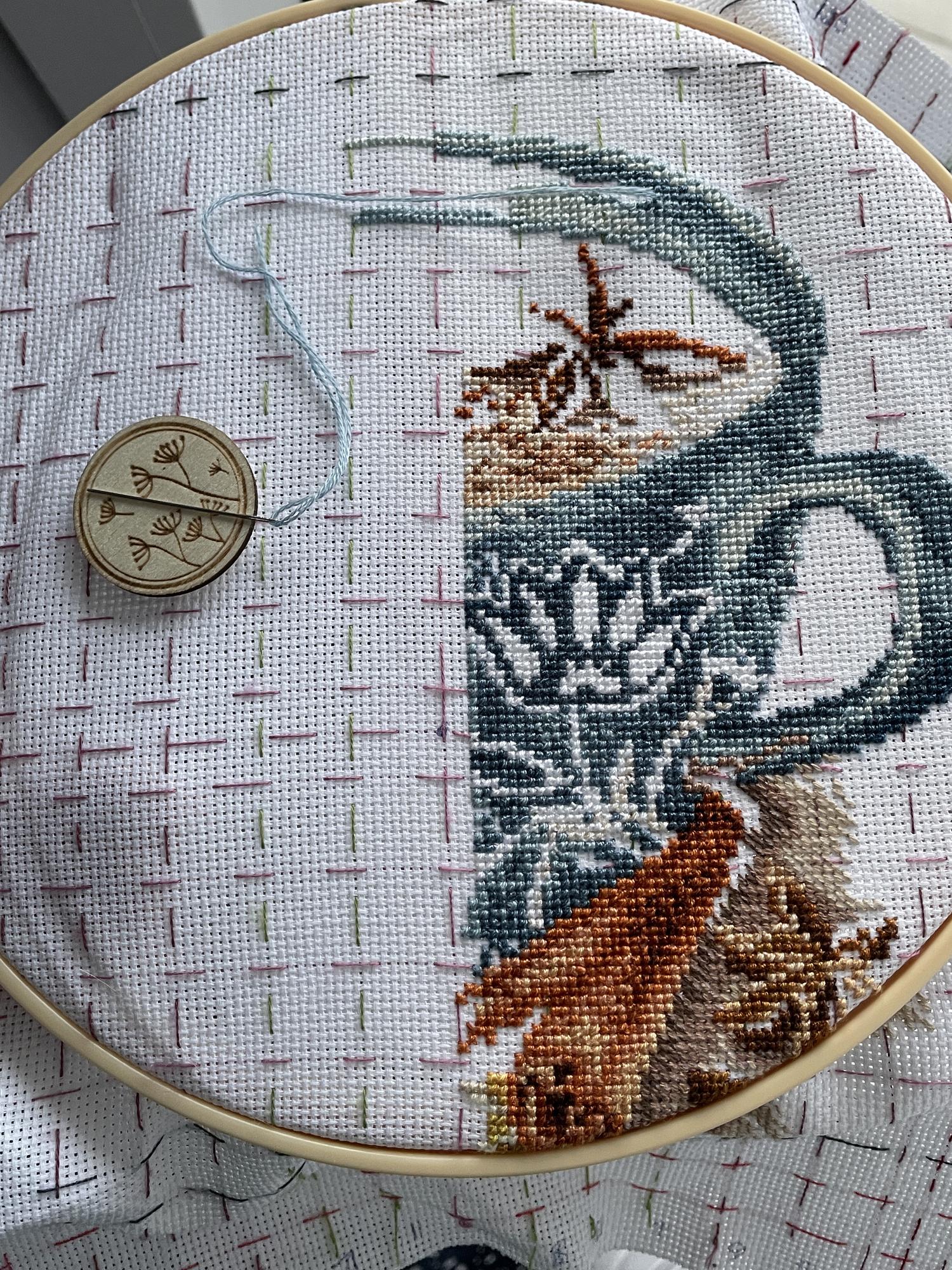 Mounted textile with dense geometric embroidery